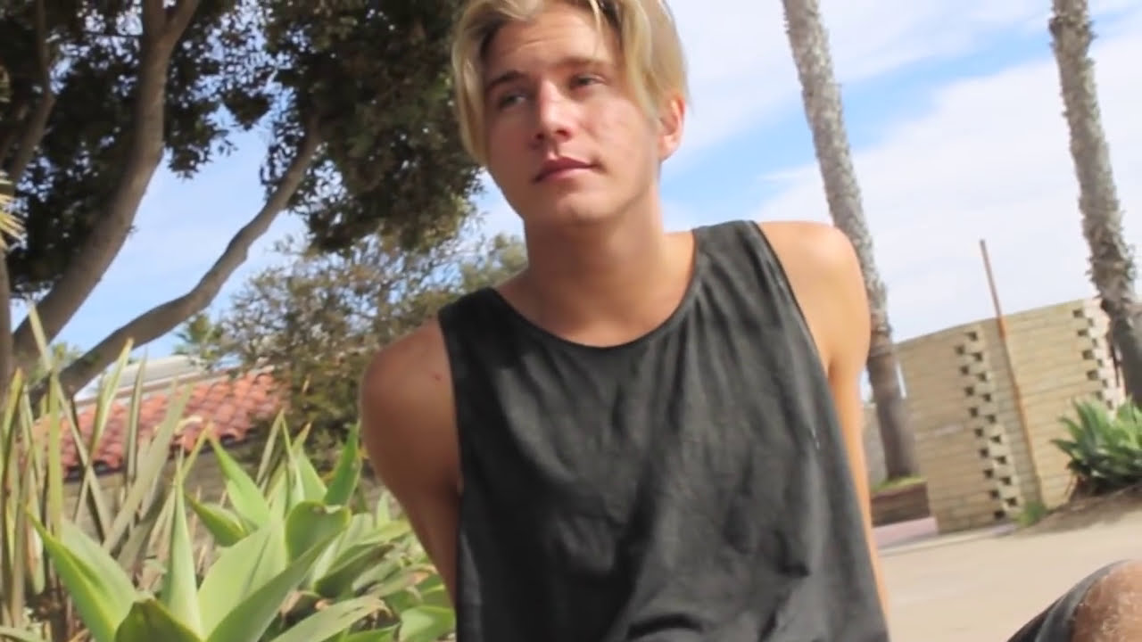blonde skater takes off his shoes
