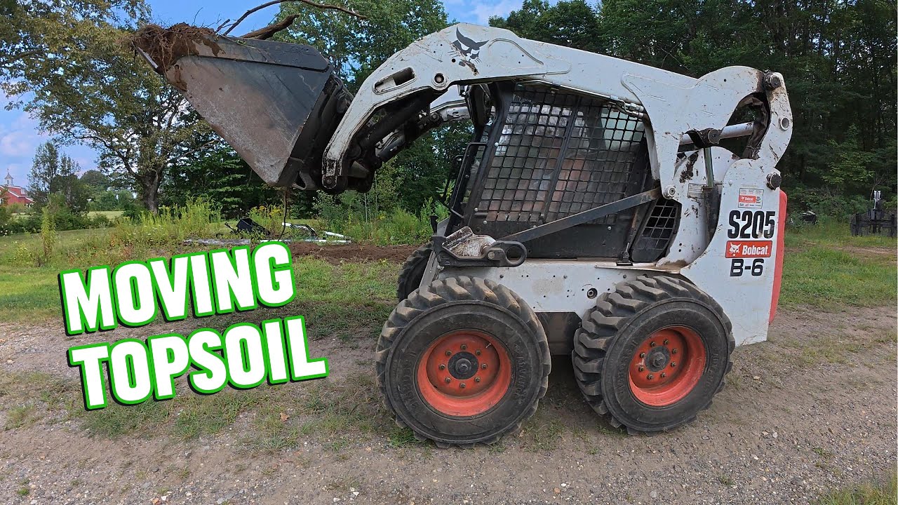 Moving Topsoil to Grade Out Hill Side Part 1