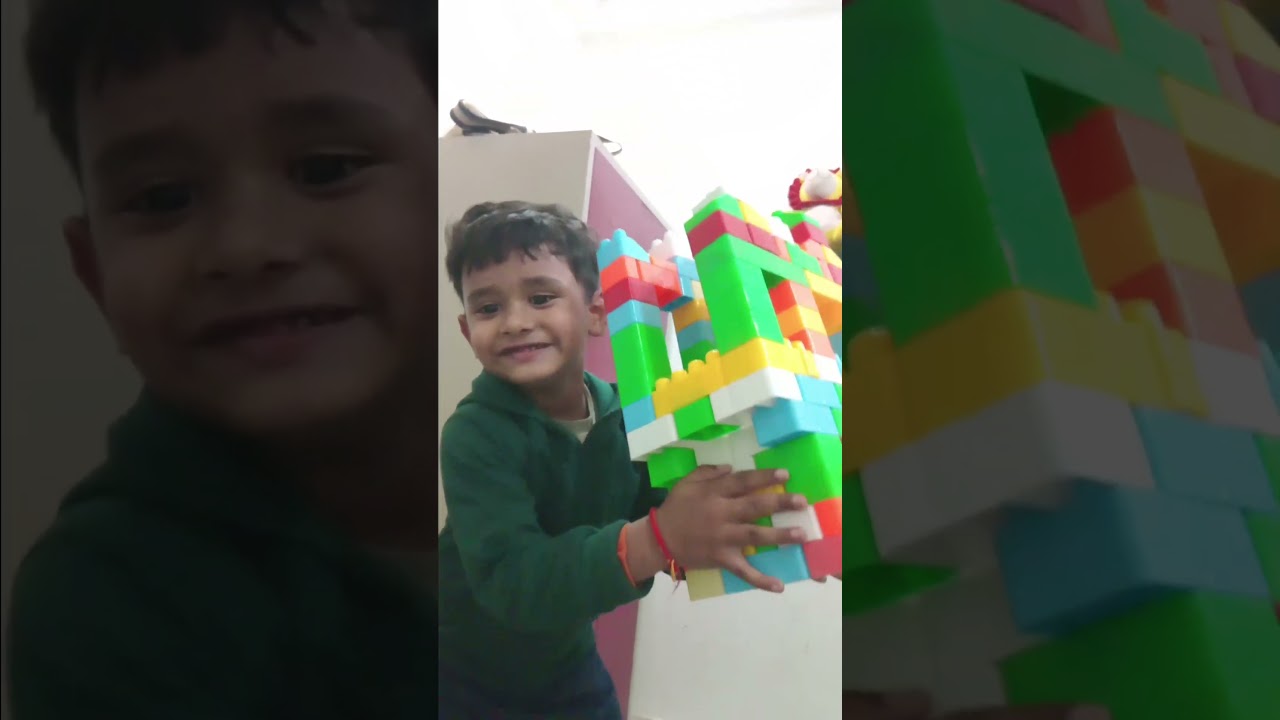 kanha playing with building blocks 
