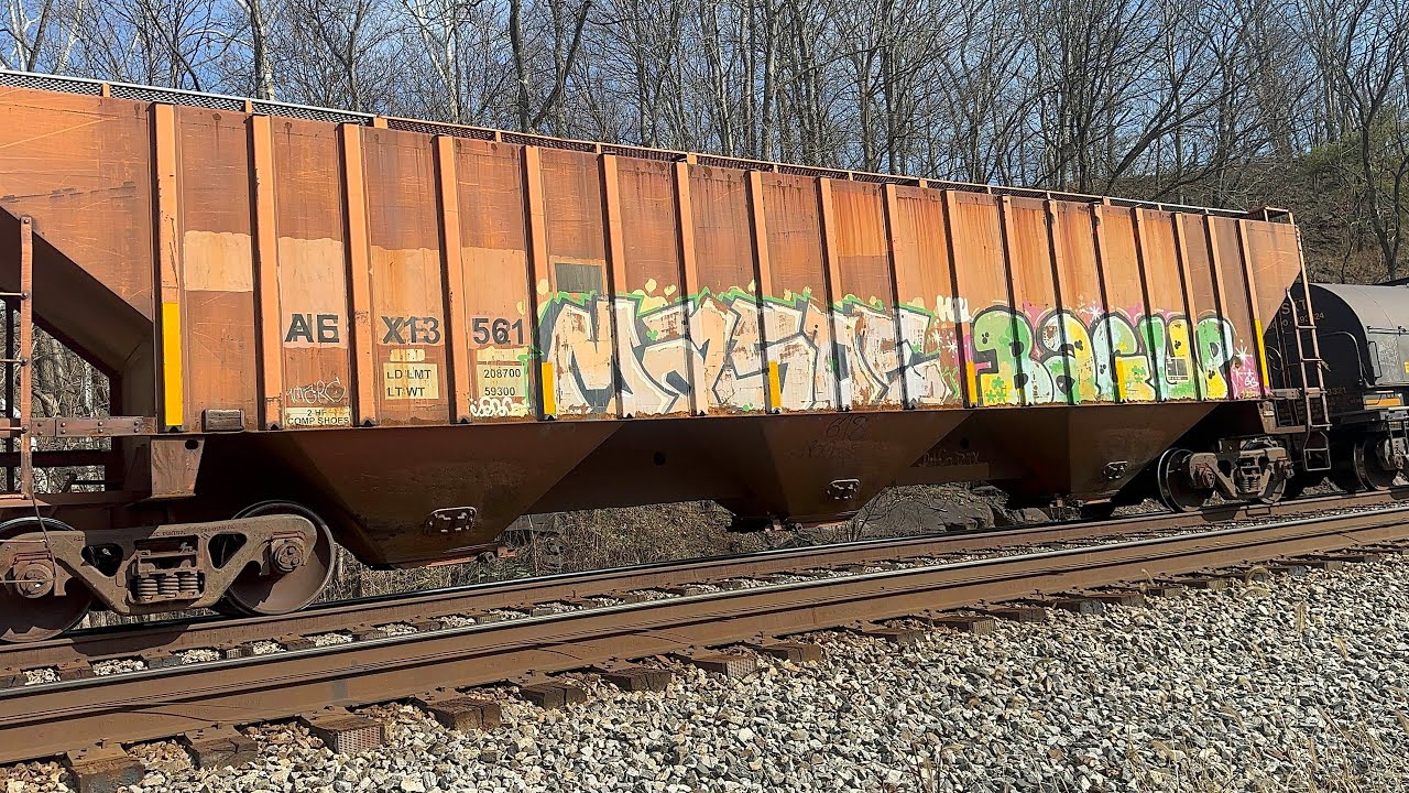 L102 crawls eastbound through Great Cacapon with a former D&RGW hopper