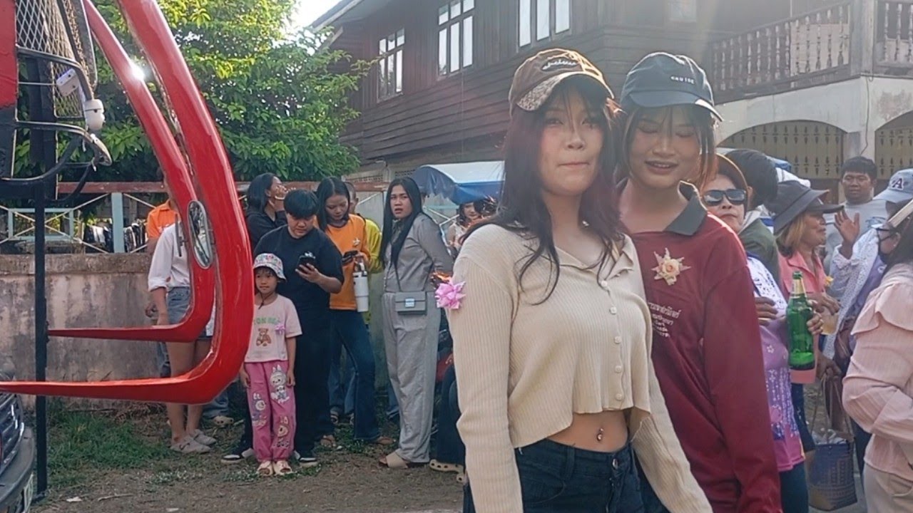 Traditional Thai village carnival with dancing and joy
