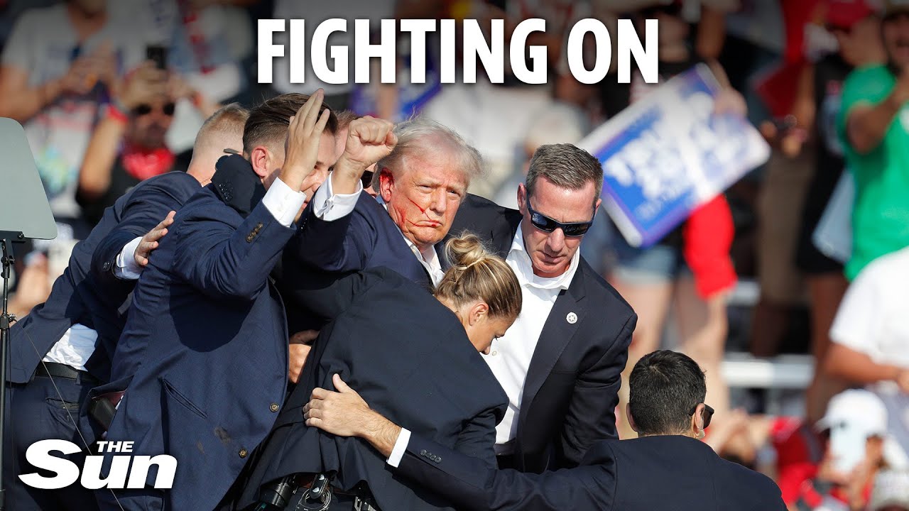 Bloodied Donald Trump raises fist in defiance and shouts 'fight!' after being shot by sniper