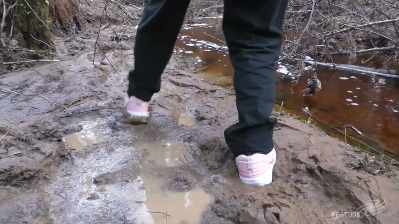 Sneakers and white socks in mud
