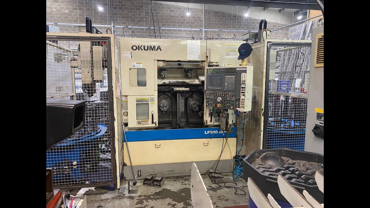 Okuma LFS10-2SP 4 Axis Twin Spindle CNC Lathe with loader-unloader and gantry system