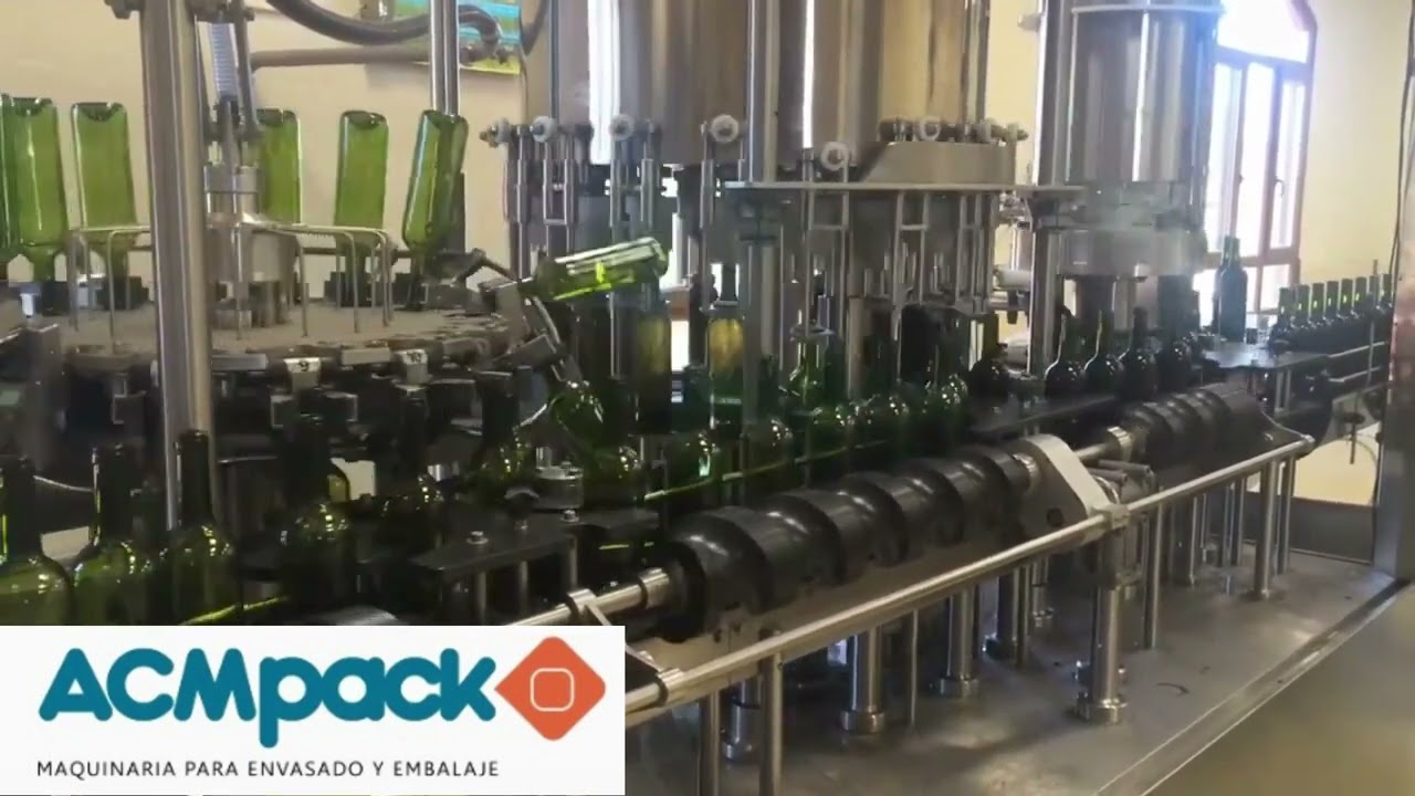 Máquina llenadora para el embotellado de vino. Quatriblock.