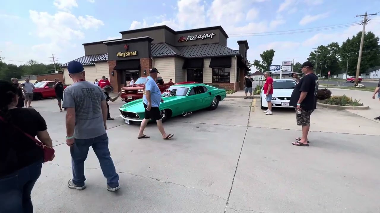Funny Cars Cruisin the streets at the Street Machine National in Duquoin. 
