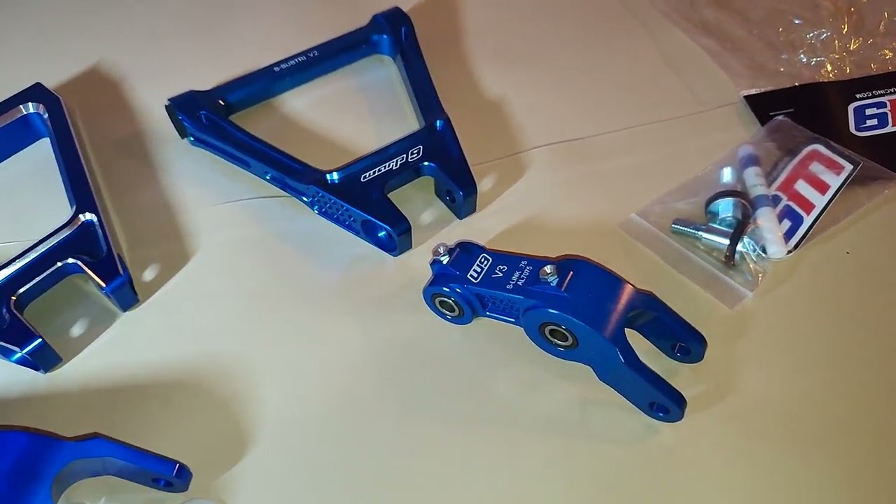 WARP 9 VS ALIEXPRESS: Surron linkage and suspension triangle compared