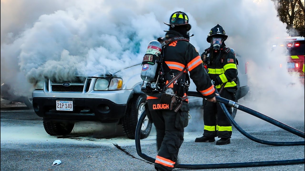Watch as firefighters had to pry open the hood in order put out a fire in the engine compartment...