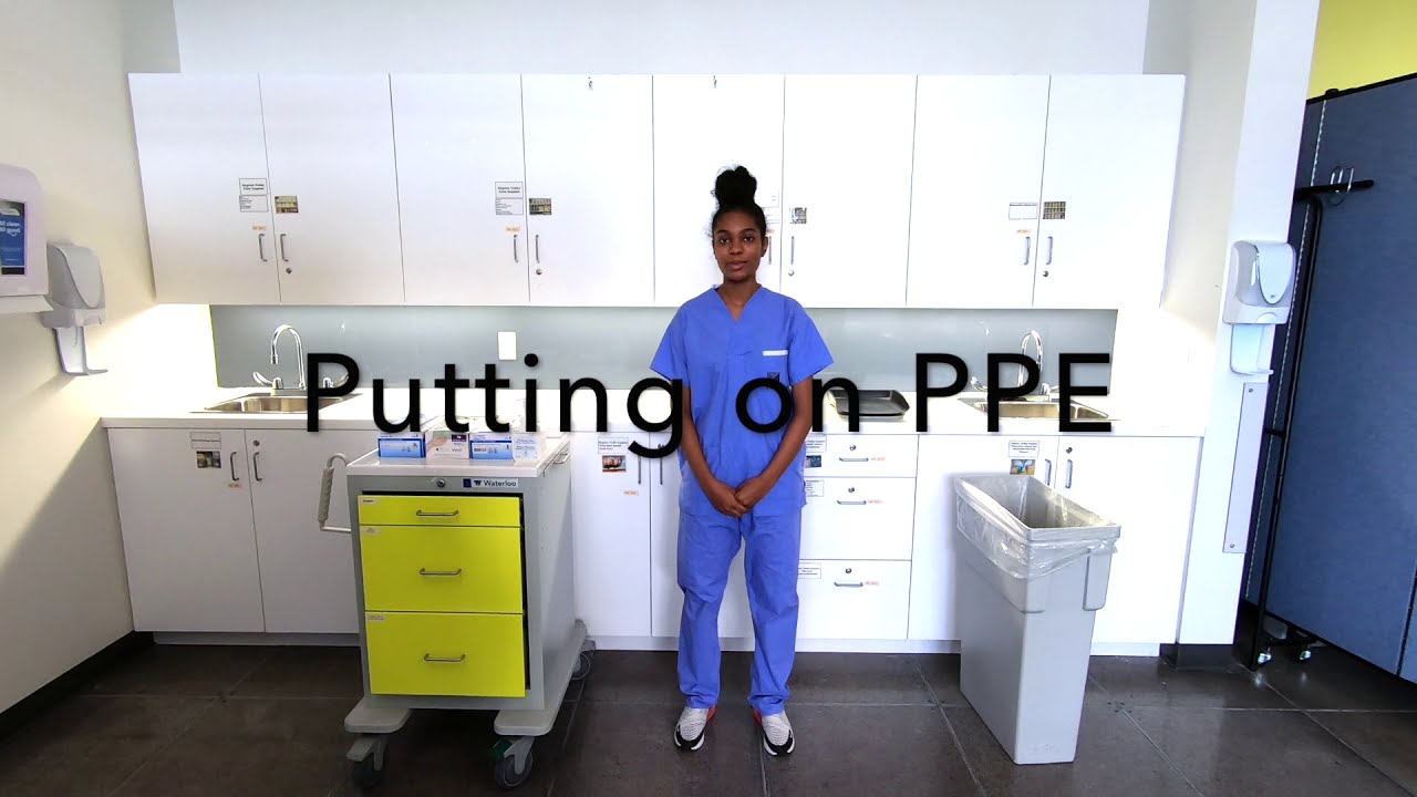 Putting on PPE.