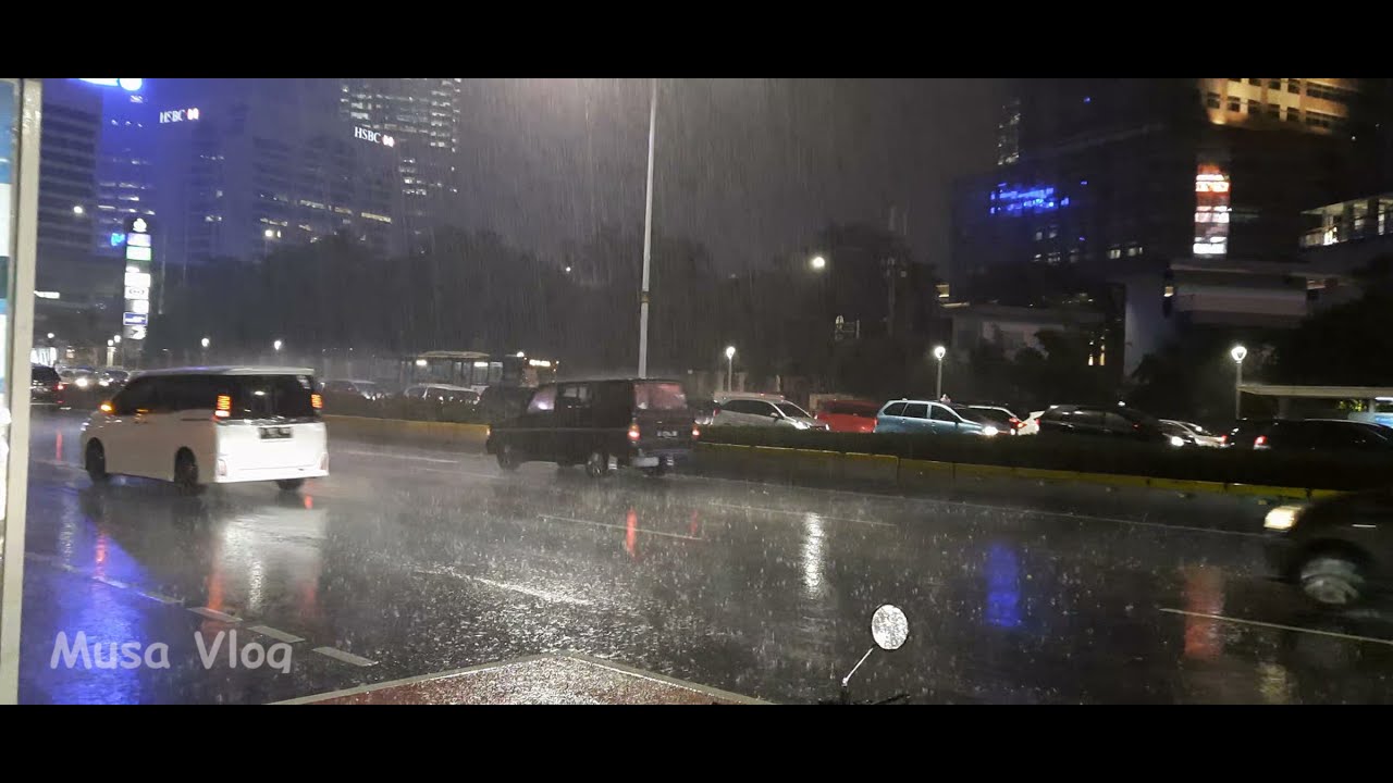 Walking on Sudirman Street Jakarta after raining and it is a nice place for walking. 