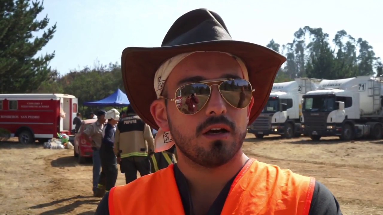 Physician treats firefighters at a wildfire near Matanzas, Chile