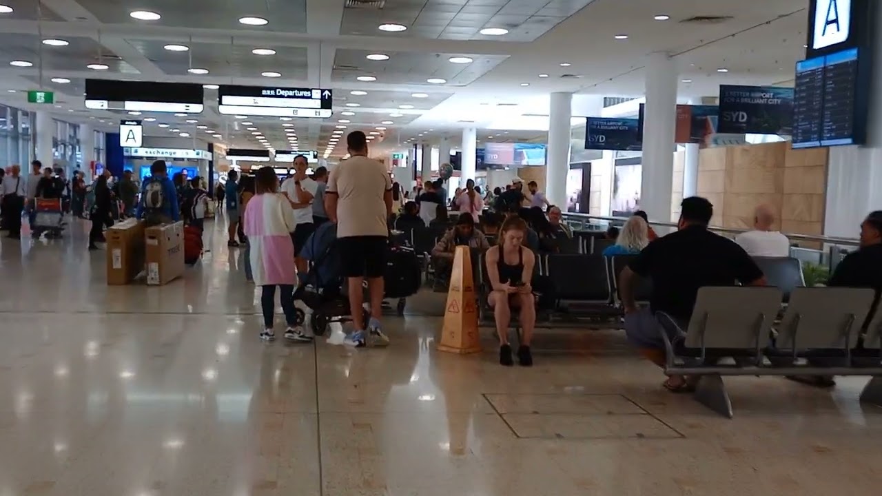 Sydney airport busy morning arrival area