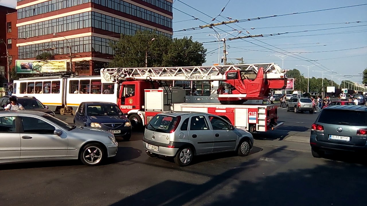 traffic jam bucharest- firetruck stuck by a broken tram