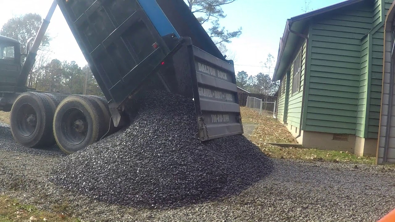 Kubota Skidsteer Spreading Gravel
