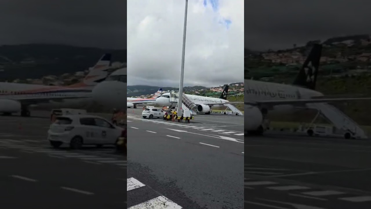 Passengers boarding via stairs at Madeira's notorious runway 