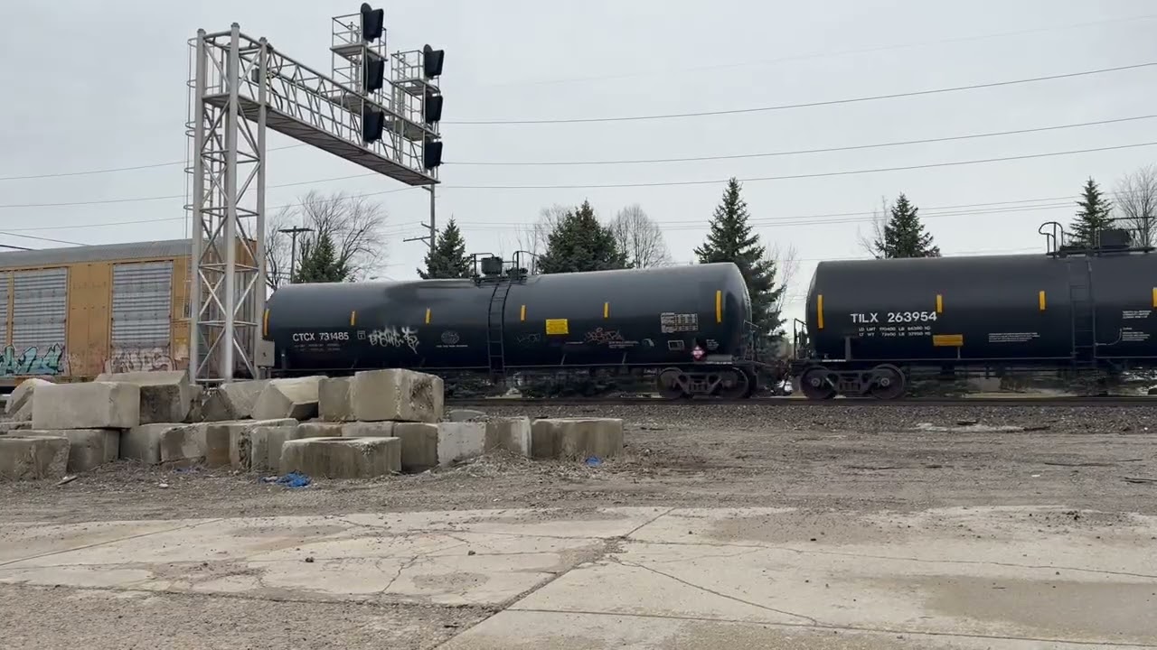 Union Pacific Mixed Freight Going Under Signal Lights - Reading & Northern car about halfway