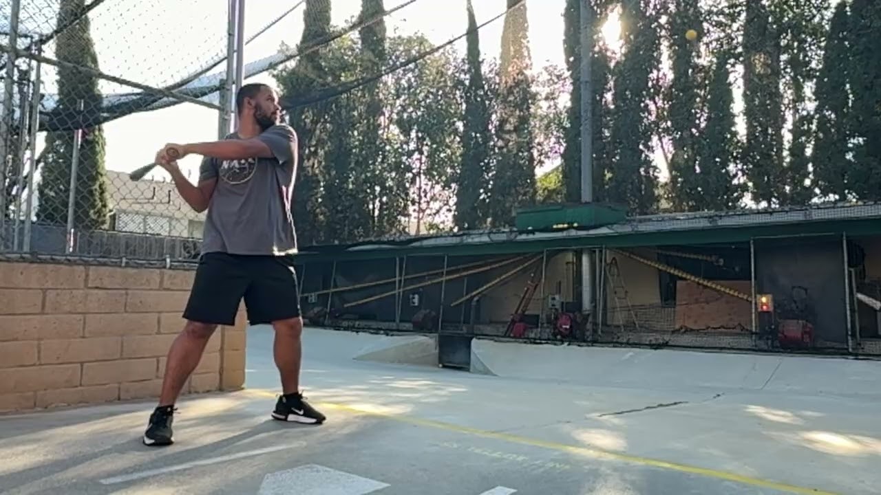 The slow motion of the next set of hits at the batting cages