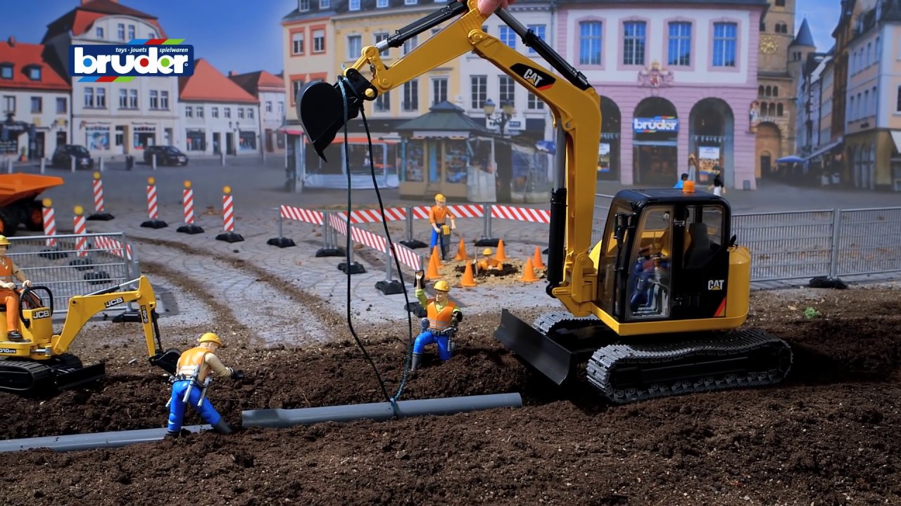 Cat&reg; Minibagger mit Bauarbeiter -- 02466 -- BRUDER Spielwaren