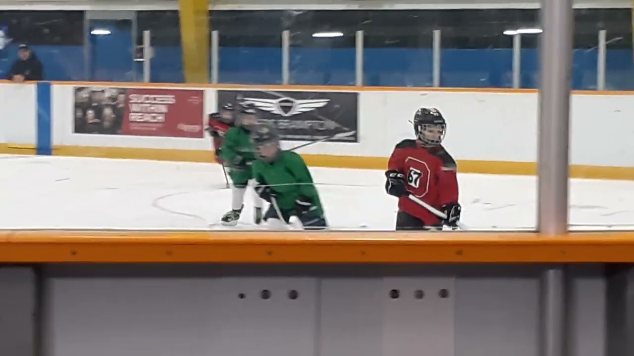 More hockey tournament about players with a coach at Terry Miller Recreation Centre