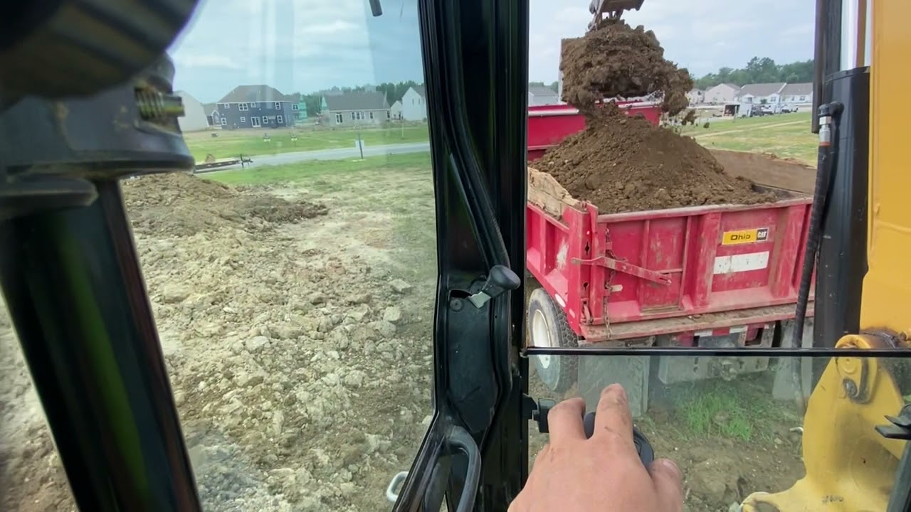 Cat 306 loading dirt