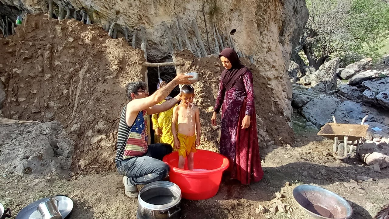 Bathing of children by nomadic parents in a traditional way