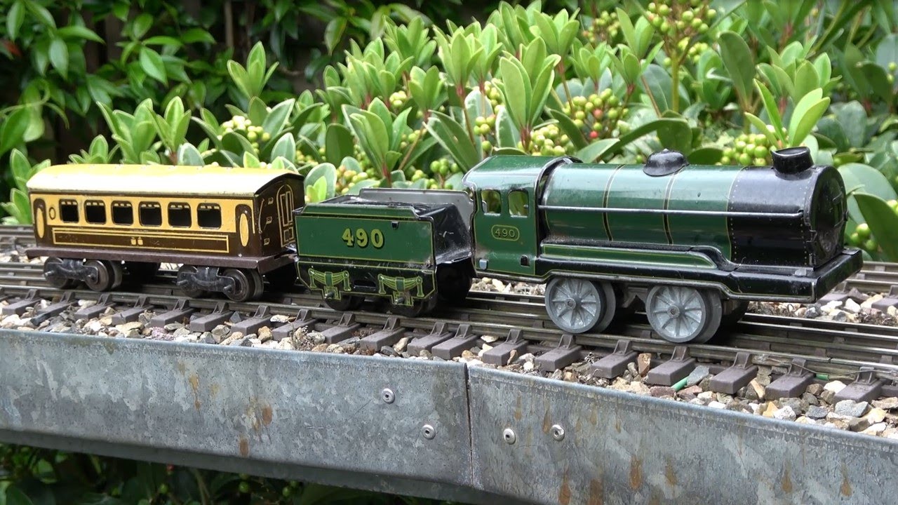 75 Years Old English Clockwork Toy Trains by Mettoy running in the garden