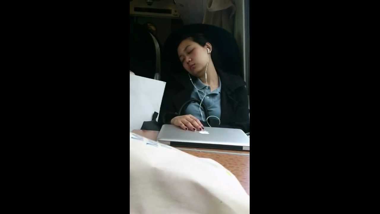 Woman asleep on the train