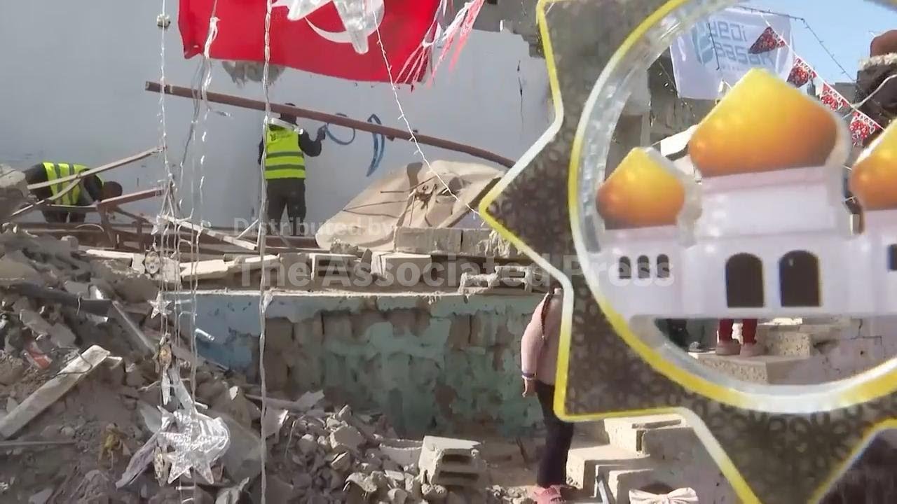 Palestinian artist paints walls of Gaza's shattered buildings to bring some joy ahead of Ramadan