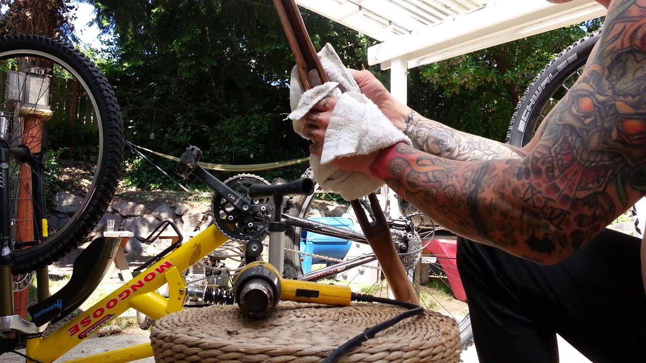 Removing oil from wood gun stock using a heat gun.