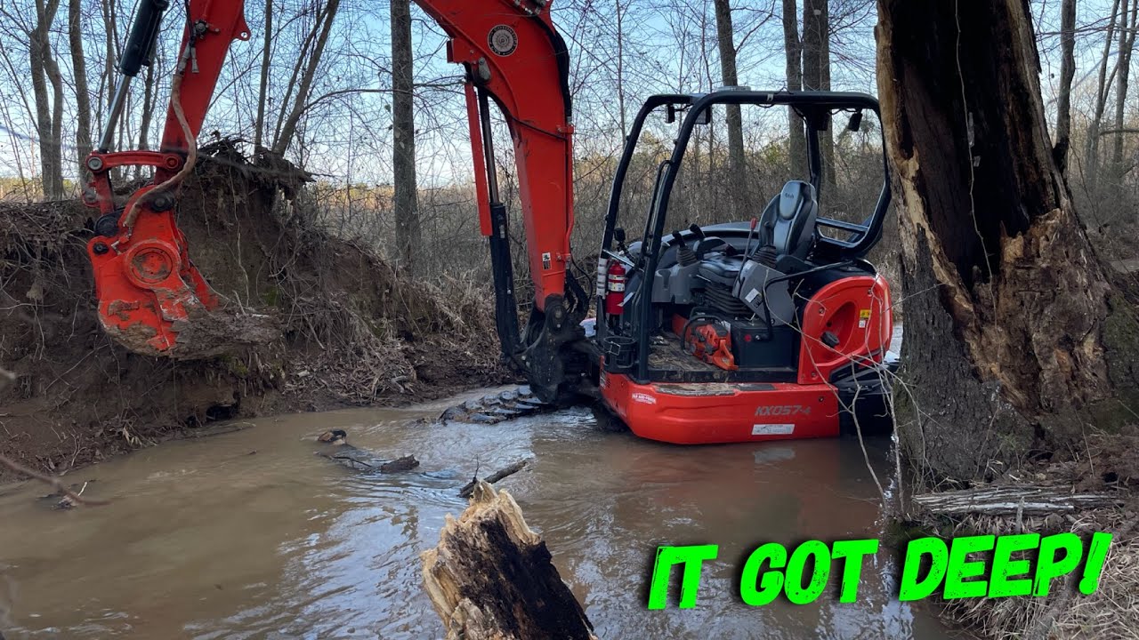 Mini excavator working flood waters
