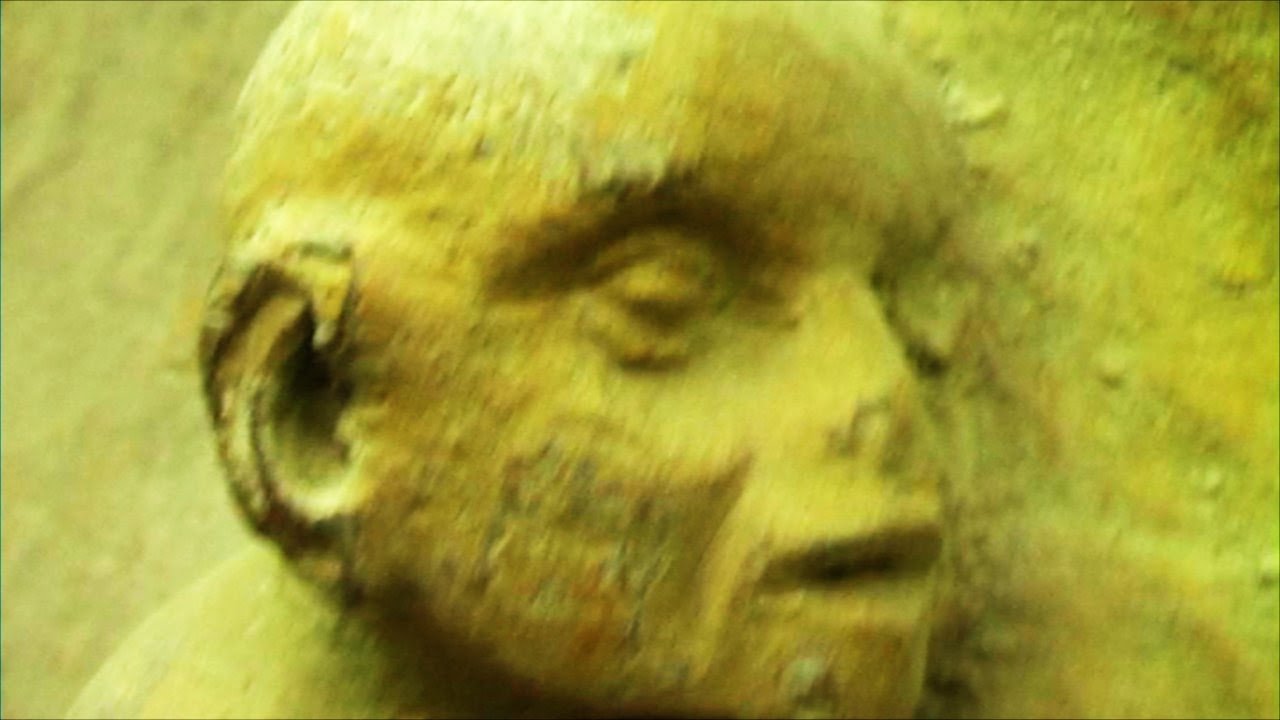 The cathedral (dark, mysterious piano and violin music) - with medieval demon statues.