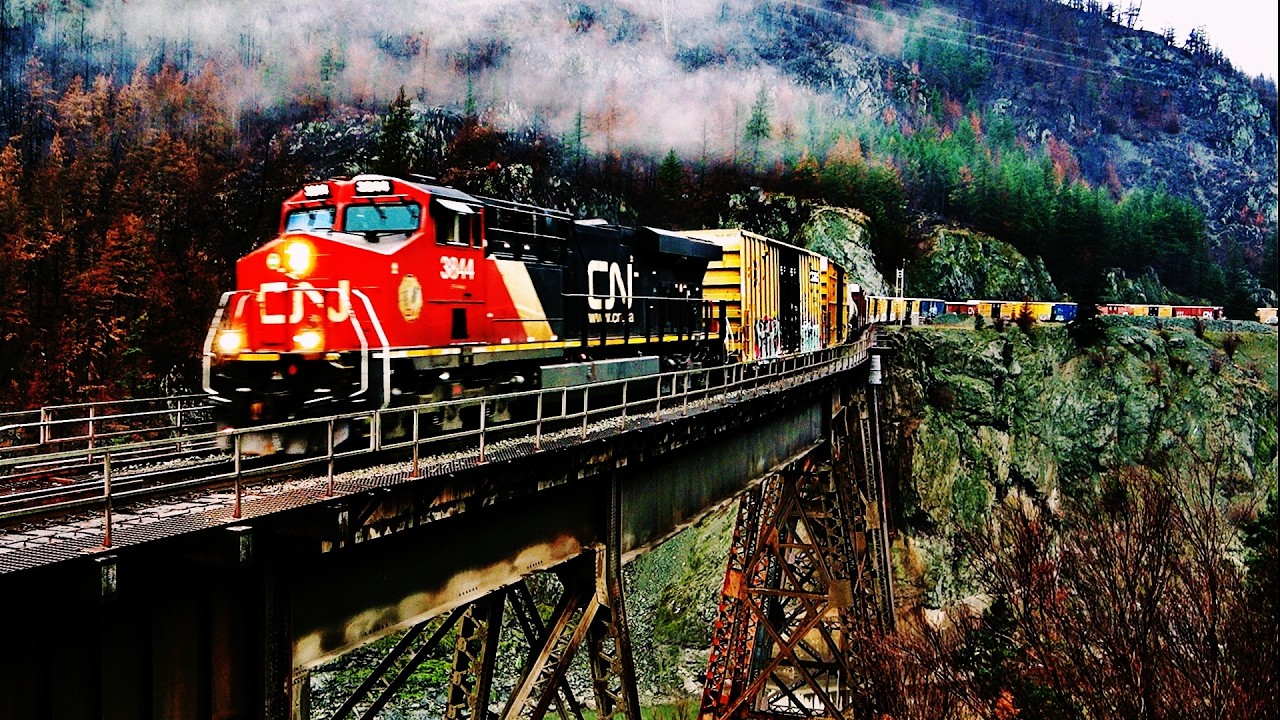 FREIGHT TRAINS THRU CANADA`S RAILFAN HOT SPOT OVER CISCO BRIDGES IN THE CANYON! 