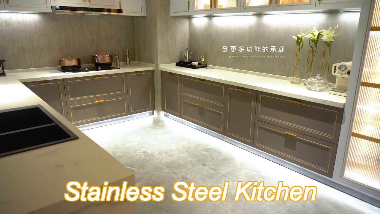 modern grey brass - trimmed kitchen cabinets - island - glass storage