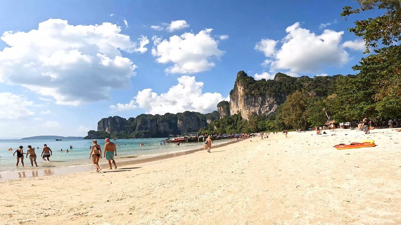 Railay Beach walk Krabi Thailand - beautiful beach resort and limestone mountains