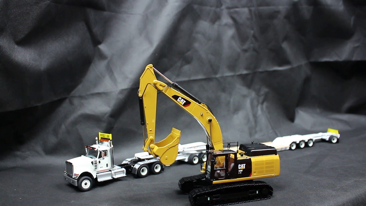 1:50 Diecast Masters International HX520 with low loader and Cat 349 excavator review