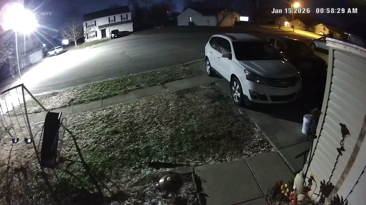 Behind tree and house 