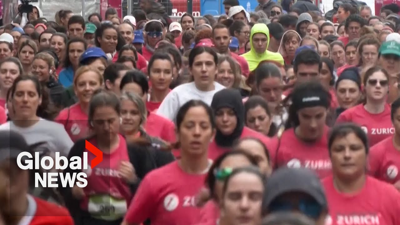 Thousands of women race through Lisbon streets to support fight against cancer