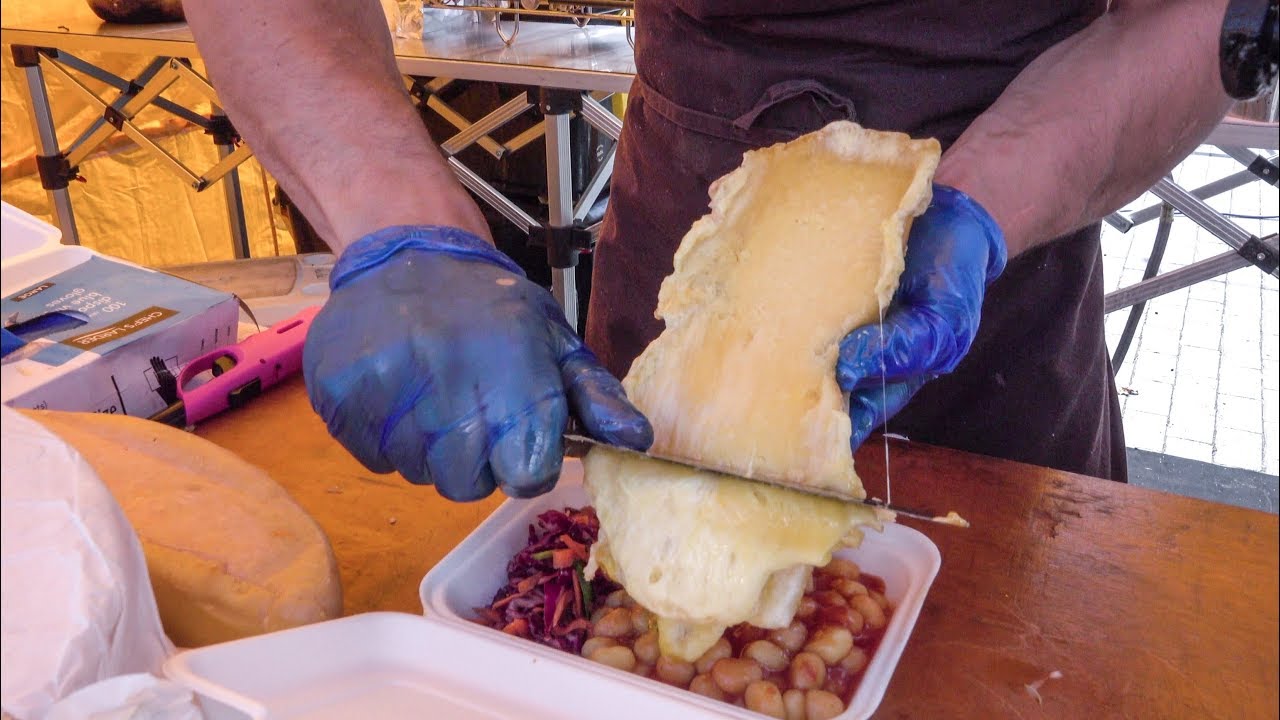 Melted Raclette Cheese Over Italian Potato Dumplings. London Street Food