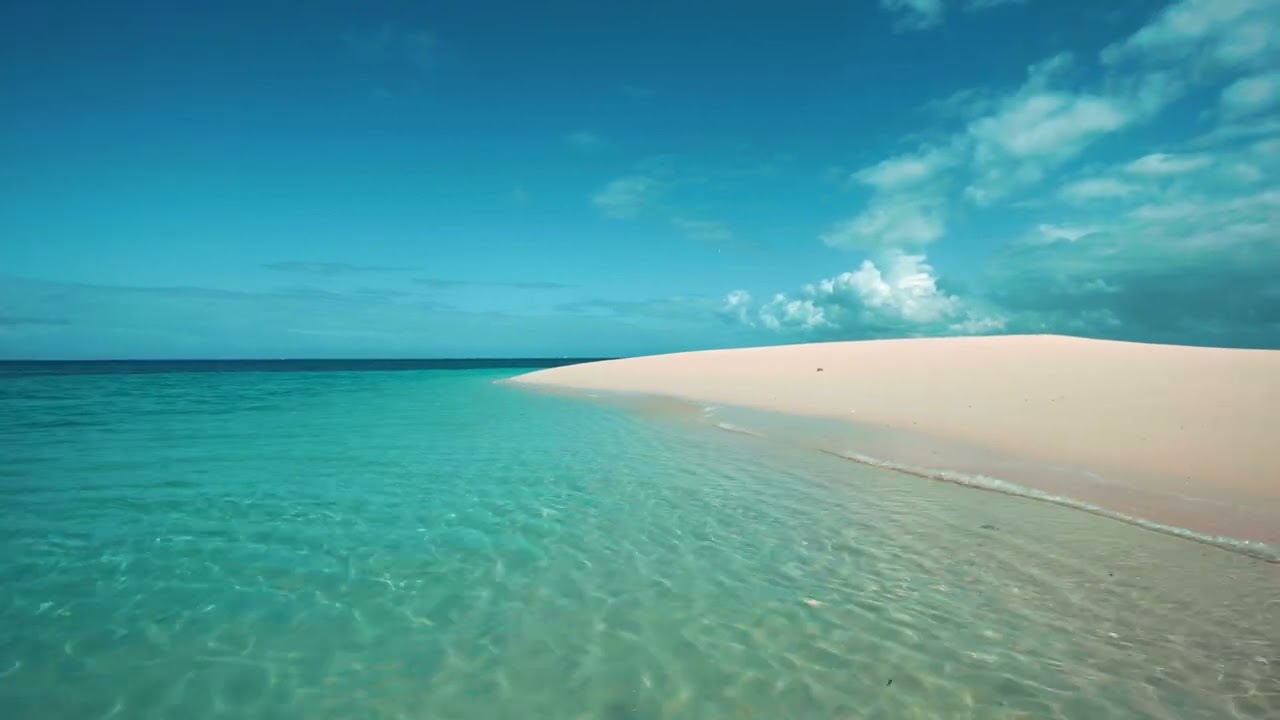 Blue Paradise - Enjoy this white sand beach while soft waves wash up on the shore in 4k