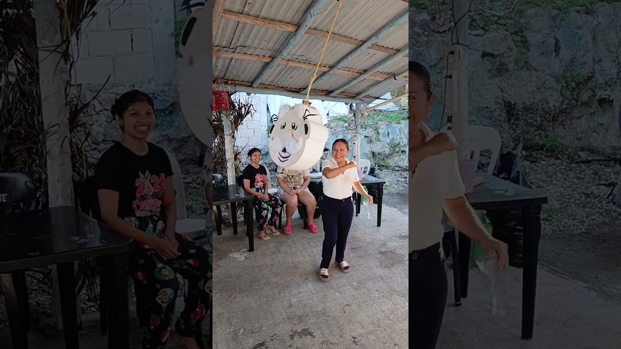 La tía Conchi rompiendo piñata 