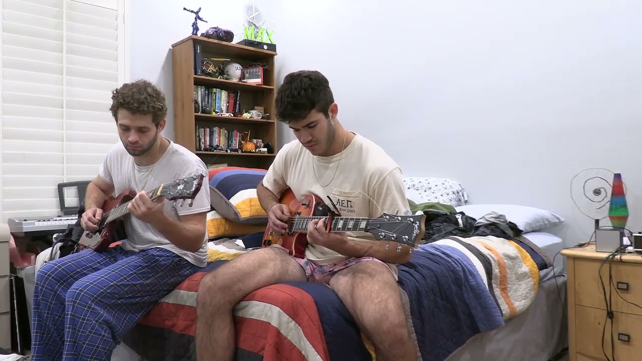 MAX AND JAKE IN A GUITAR DUO.