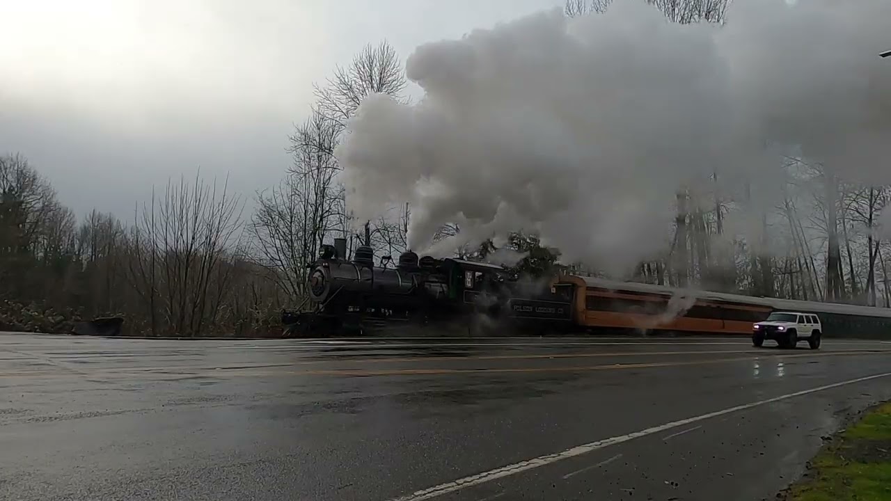 Mount Rainier Scenic Railroad Steam Train Departing Elbe Station with Road Crossing