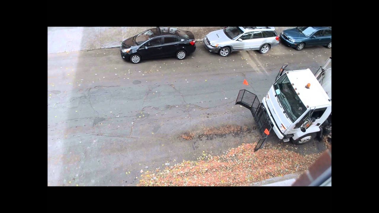 MONTREAL STREET CLEANER SWEEPING LEAVES