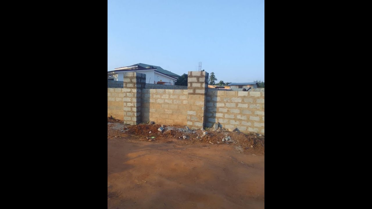 BUILDING A HOUSE IN GHANA 🇬🇭Fence Wall //step 2// Rebuilding the fence wall & Cost.