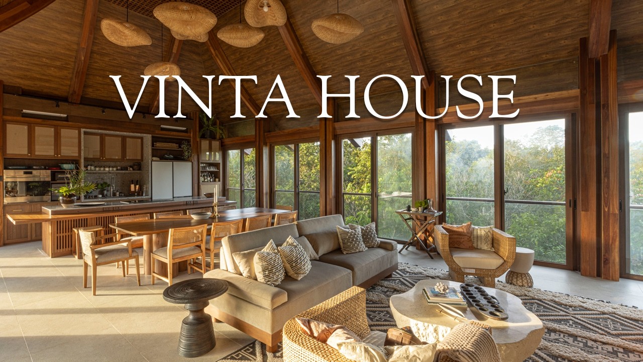 Enter this tropical home with a swooped roof that hides a 3rd floor