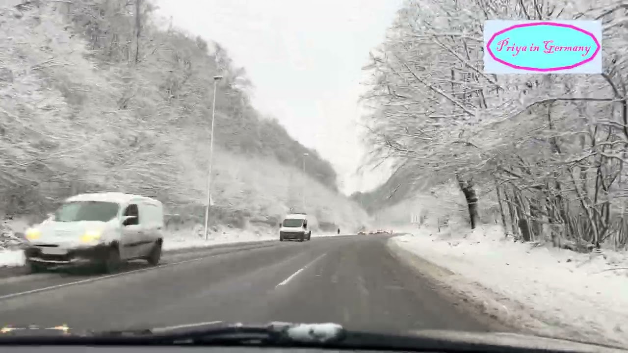 A beautiful drive in the woods after snow storm in Aachen, Germany