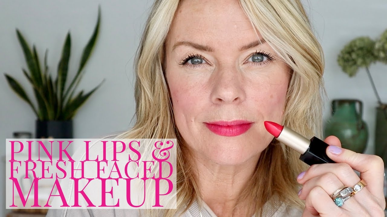 Bright pink lips and fresh faced makeup