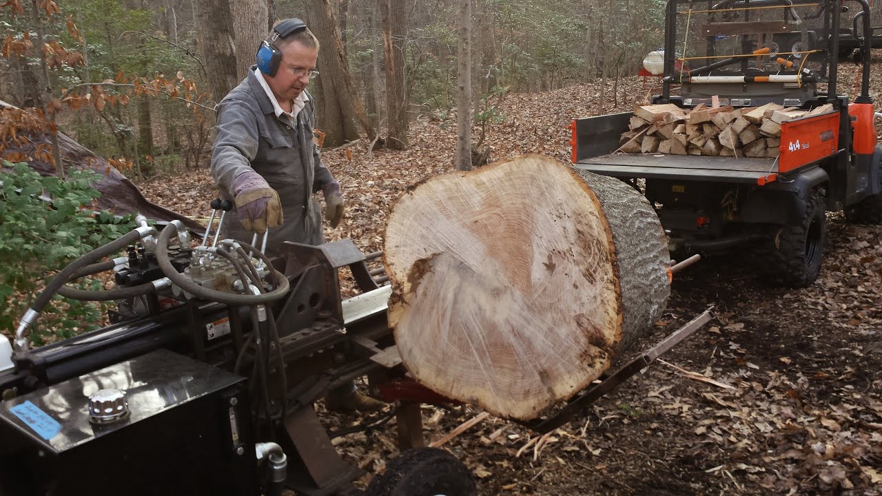 Home made log splitter with log lift and four way adjustable wedge