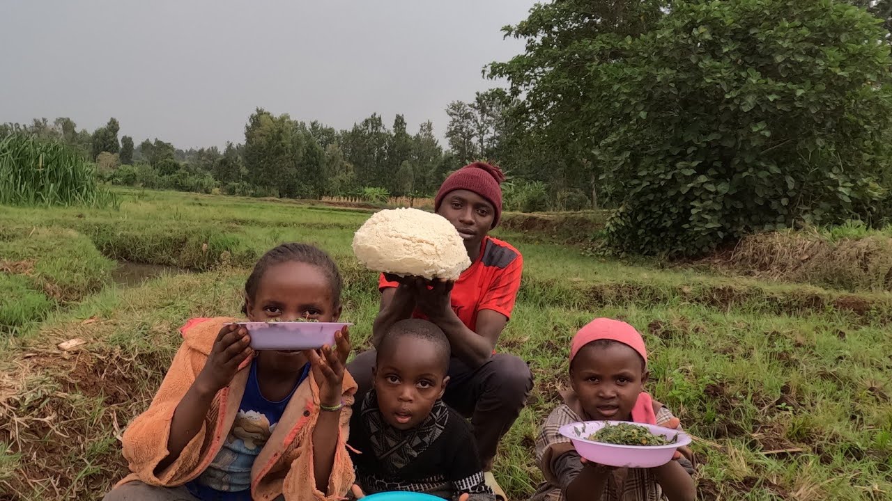 Authentic african village life cooking ugali and fish freshly harvested from the river