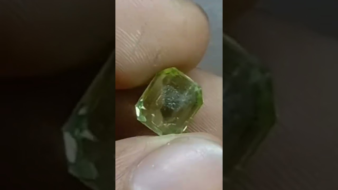 Emerald cut Peridot apple colour with some inclusion cut by Hijazigems